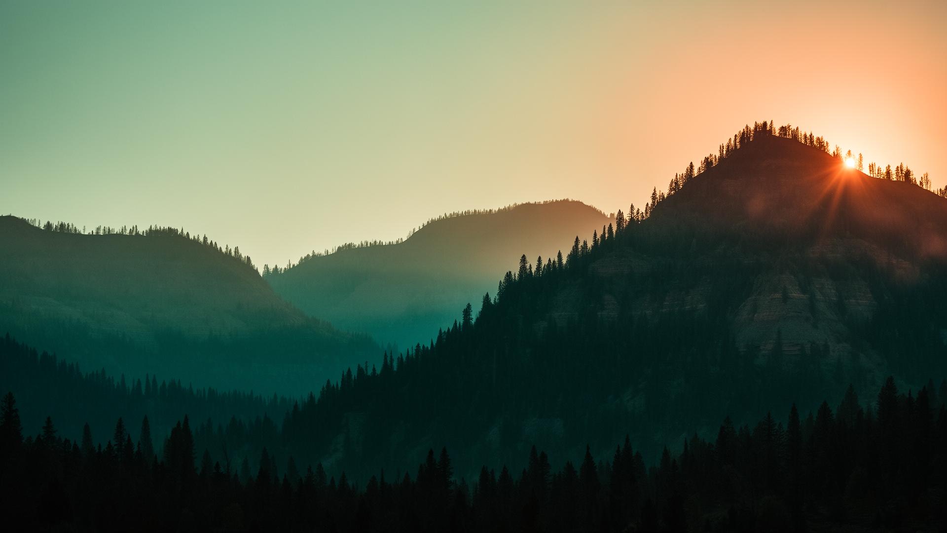 Pre-dawn Utah ridgeline with first light cresting the highest peak